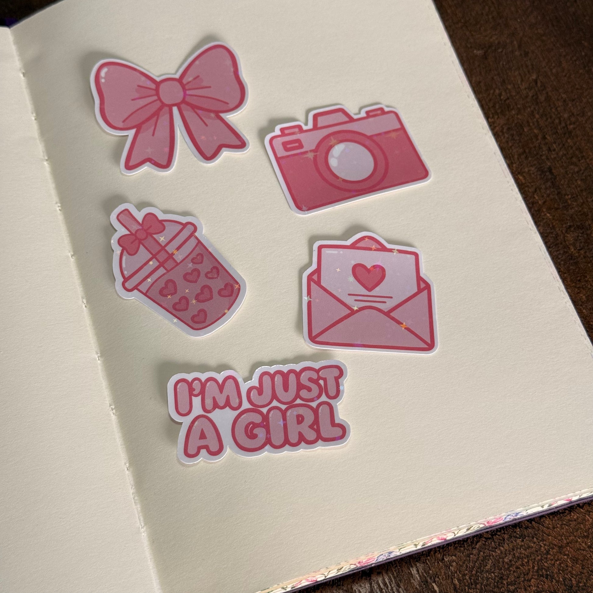 Printed die-cut sticker pack with pink designs and holographic star finish