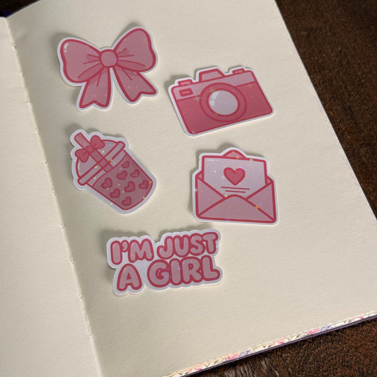 Printed die-cut sticker pack with pink designs and holographic star finish